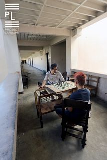 Playing Chess in a Temporary Refuge. - 
