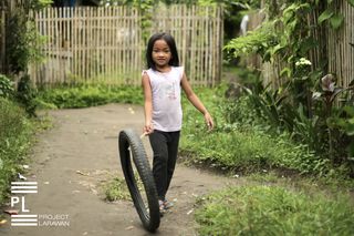 Girl and a Tire. Polomolok. South Cotabato. - 
